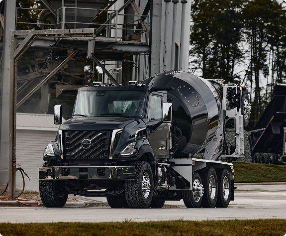 A view of a black color Volvo VNX Concrete Dump.
