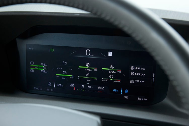 A close-up view of the dashboard with a part of the steering wheel visible on the outside.