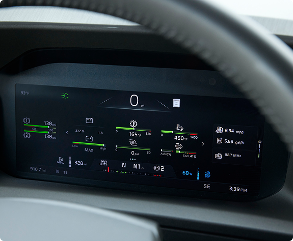 A close up view of the dashboard with a portion of the steering wheel that's visible.
