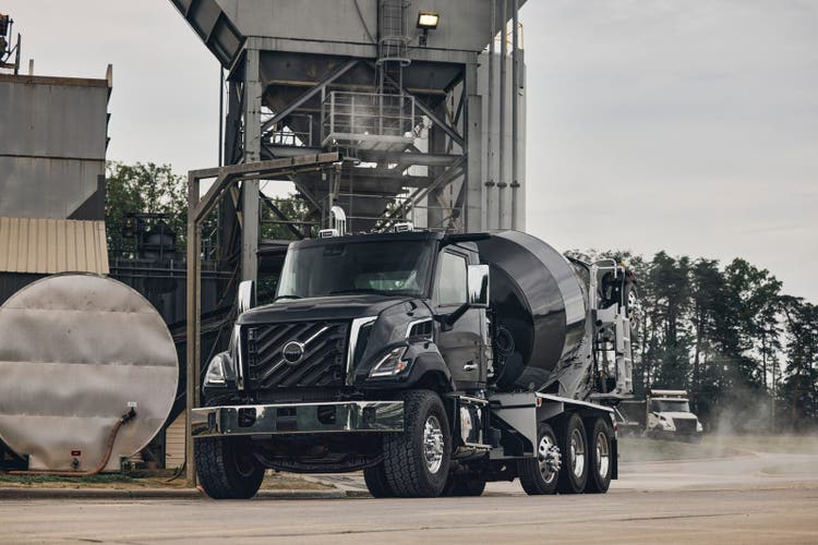 A front view of a black color Volvo VNX Mixer on a construction site.