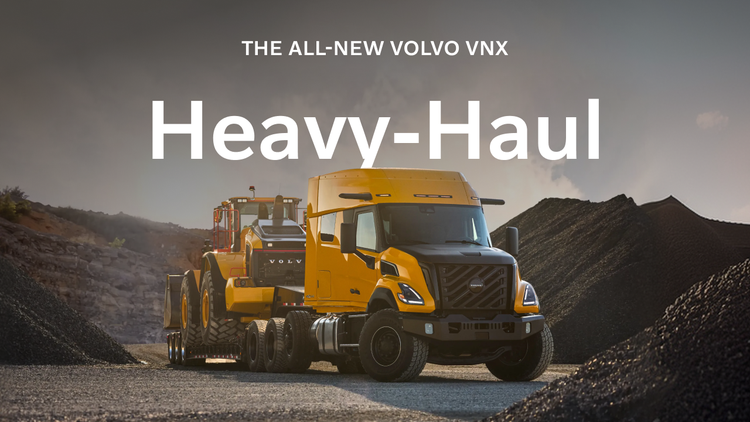 A yellow colored Volvo VNX Heavy-Haul with a text overlay that reads "The All-New Volvo VNX. Heavy-Haul."